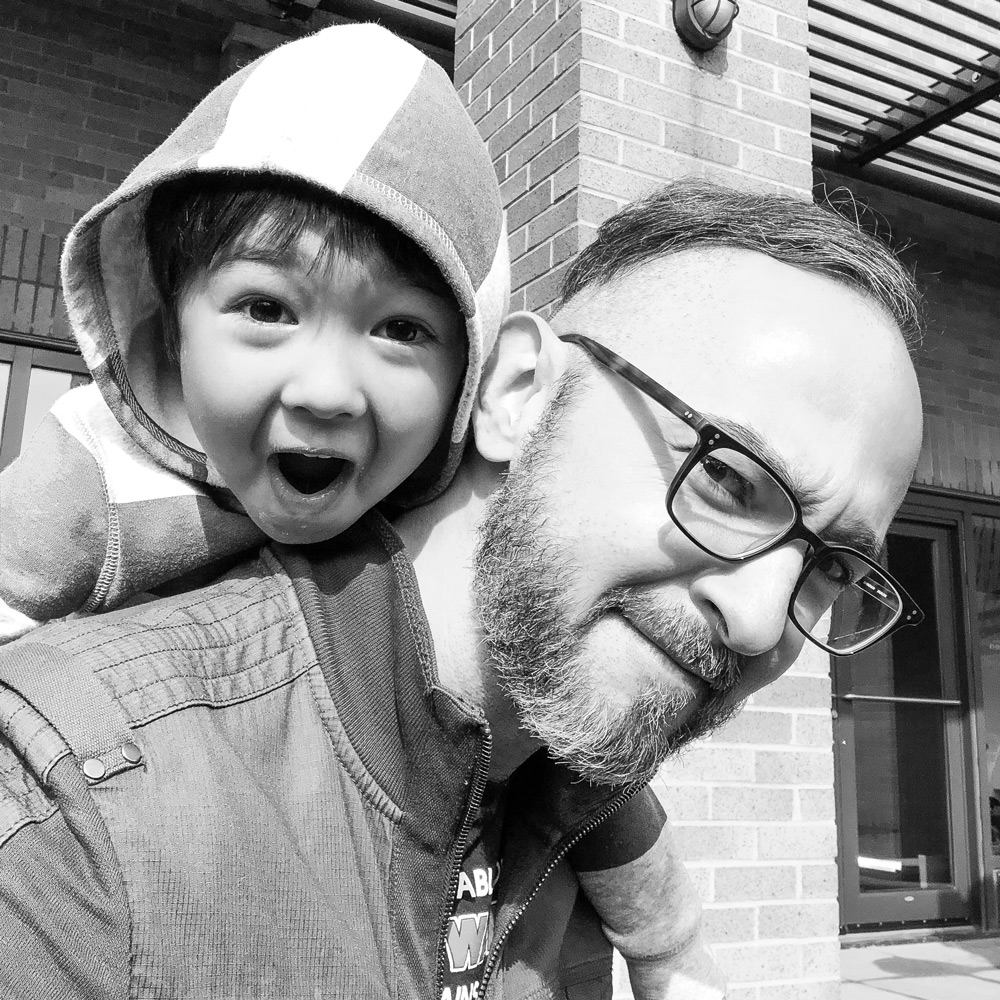 Justin with his son on his back